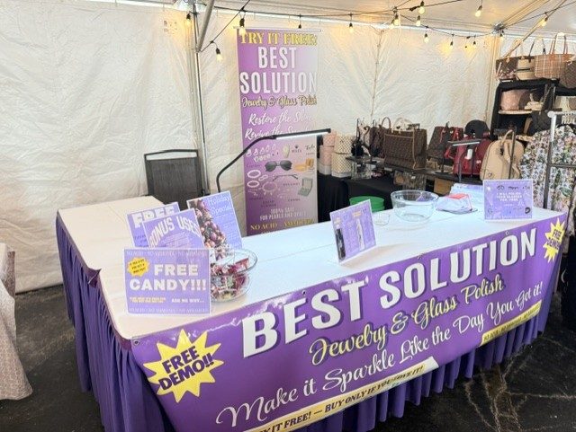 Best Solution booth under a tent with free candy